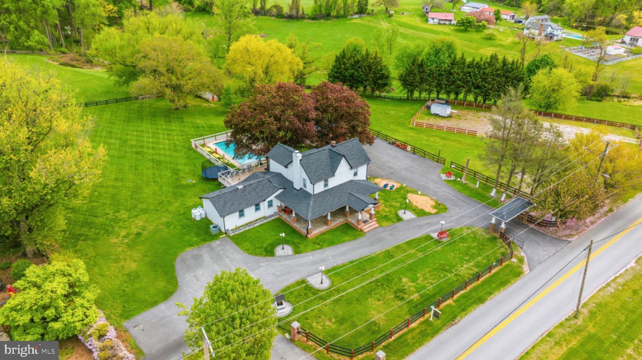 3524 Blenheim Road Phoenix, MD 21131 - Photo 3 of 61 an aerial view of a house with a garden and lake view