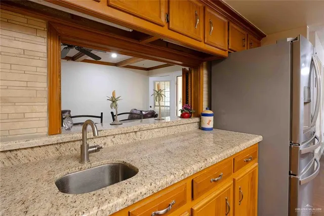 a room with gym equipment and view of living room