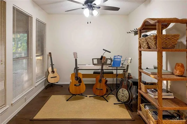a living room with fireplace furniture and a flat screen tv