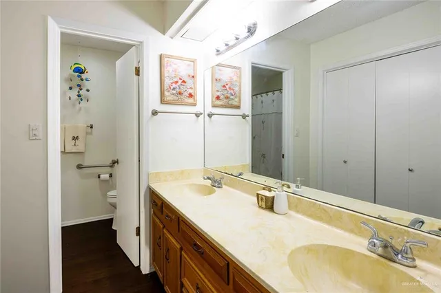 a bathroom with a sink a mirror and a shower