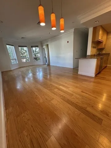 a view of a livingroom with wooden floor