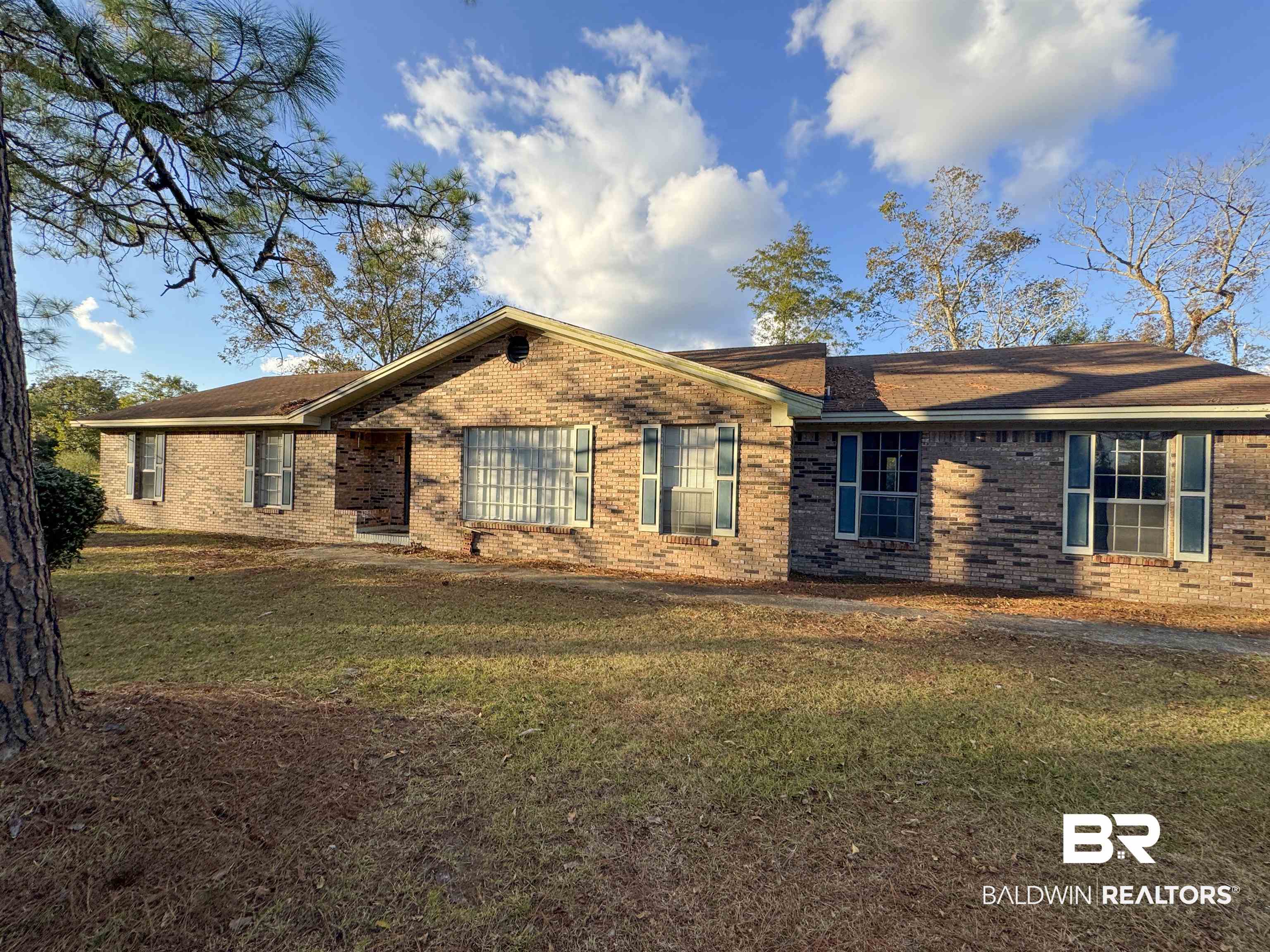 1227 Northgate Drive Atmore, AL 36502 - Photo 1 of 14 Ranch-style house with brick siding and a front lawn