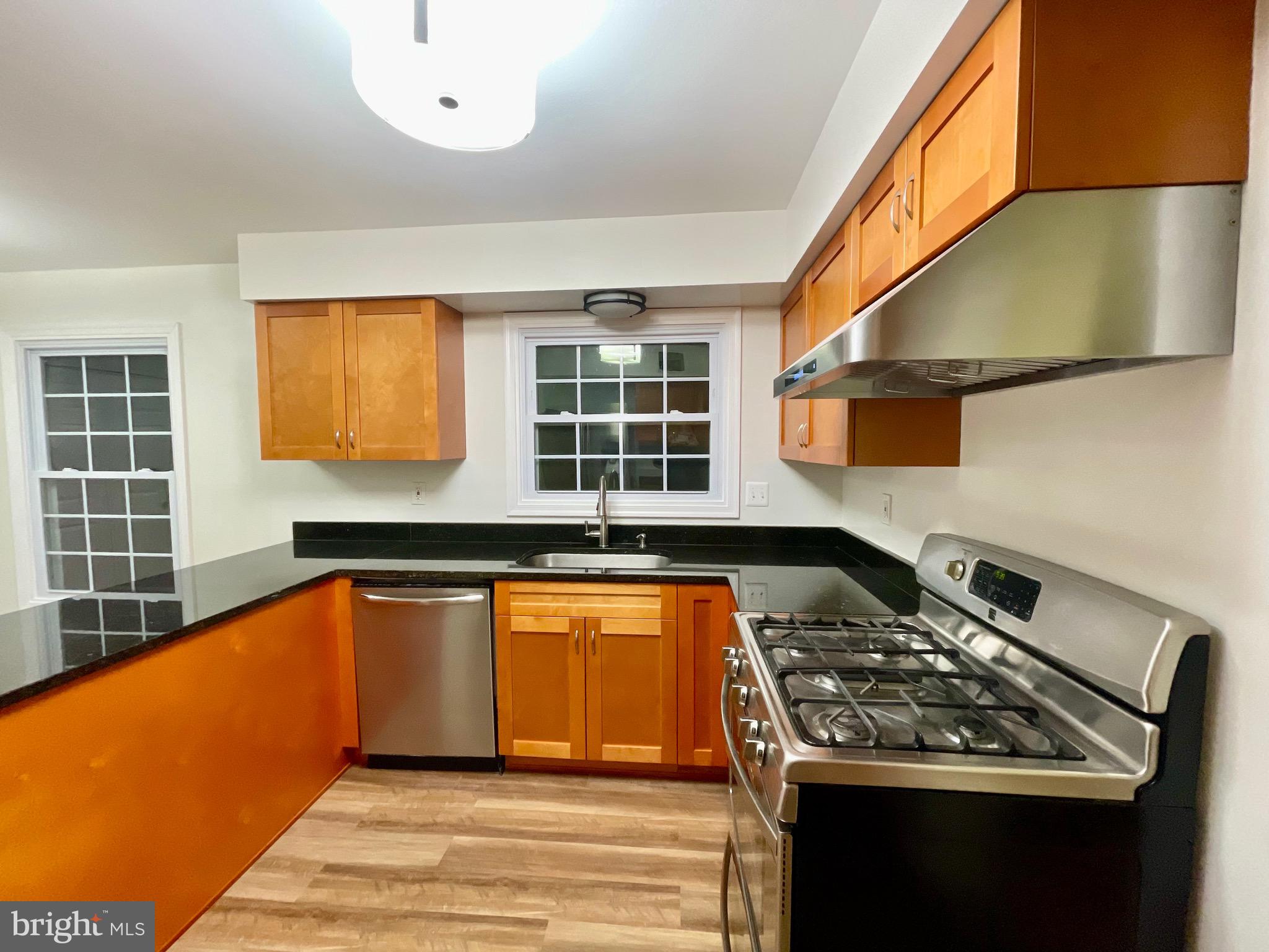325 Prelude Drive Silver Spring, MD 20901 - Photo 16 of 48 Gas stove with exhaust fan