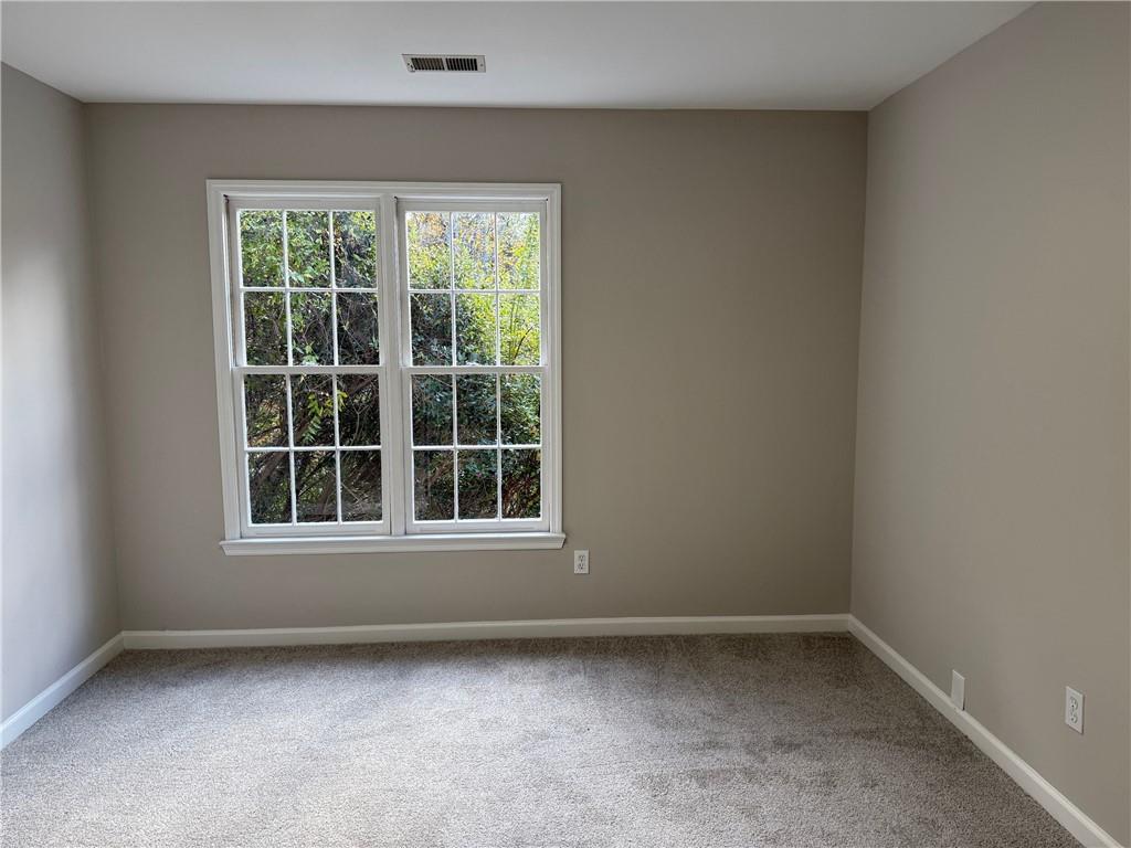 5325 Hillgate Crossing Alpharetta, GA 30005 - Photo 22 of 35 an empty room with a window