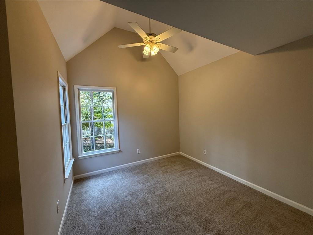 5325 Hillgate Crossing Alpharetta, GA 30005 - Photo 27 of 35 an empty room with a window and a fan