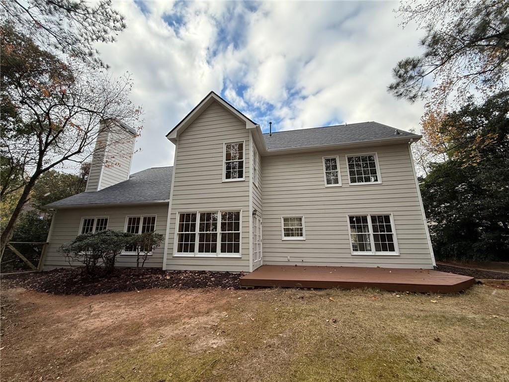 5325 Hillgate Crossing Alpharetta, GA 30005 - Photo 32 of 35 a front view of a house with a garden