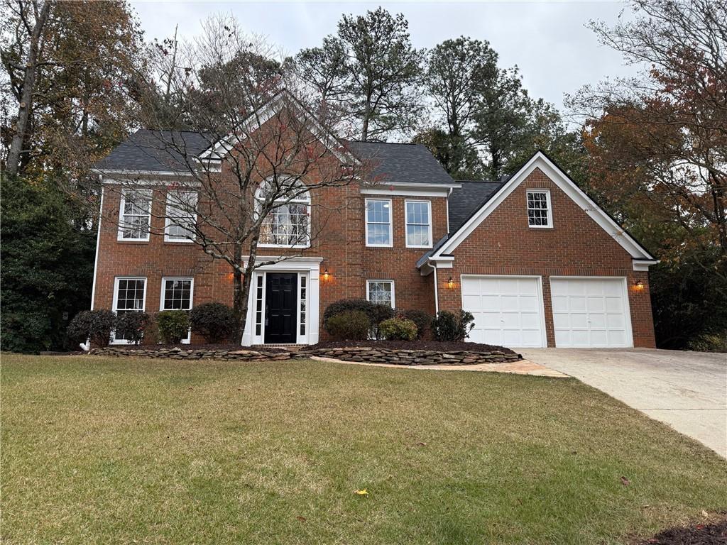 5325 Hillgate Crossing Alpharetta, GA 30005 - Photo 35 of 35 a front view of a house with a yard