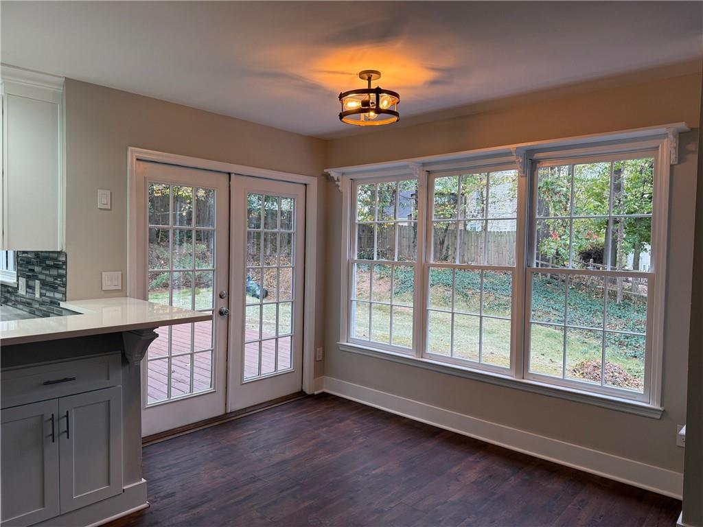 5325 Hillgate Crossing Alpharetta, GA 30005 - Photo 6 of 35 a view of a room with a window and wooden floor