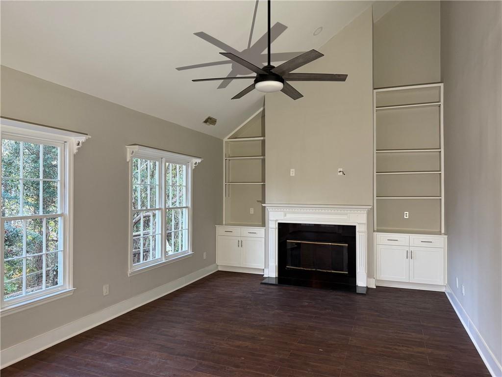 5325 Hillgate Crossing Alpharetta, GA 30005 - Photo 9 of 35 wooden floor fireplace and windows in an empty room