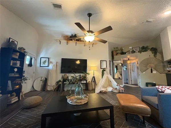 a view of a livingroom with wooden floor