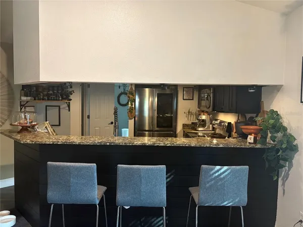 a kitchen with a table and chairs in it