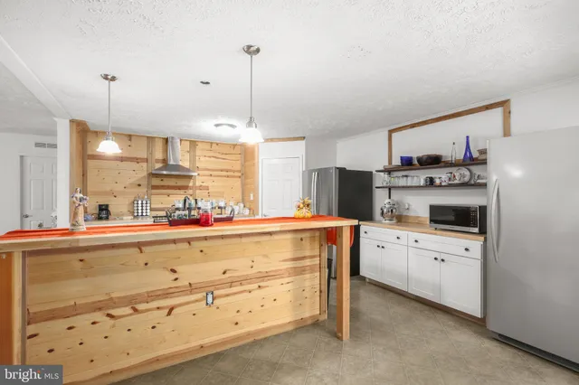 a kitchen with cabinets and window