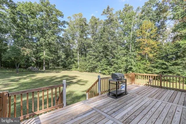 a view of a balcony with wooden floor