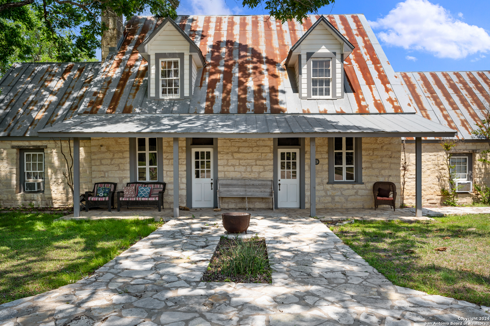 109 Waring Welfare Road Boerne, TX 78006 - Photo 7 of 21 a front view of a house with a yard