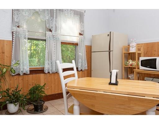 94 King Philip Road Worcester, MA 01606 - Photo 7 of 17 a kitchen with a refrigerator a stove and a potted plant