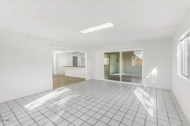 a bathroom with a granite countertop sink a toilet and a mirror