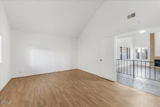 a bathroom with a double vanity sink a mirror and shower