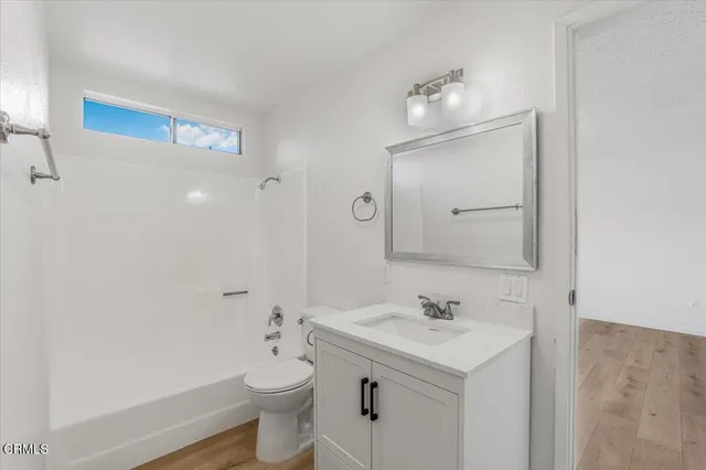 a view of a house with a tree