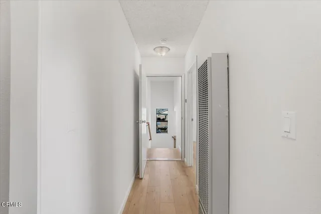 a view of a chairs and table in the backyard