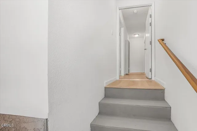 a view of a pathway both side of house