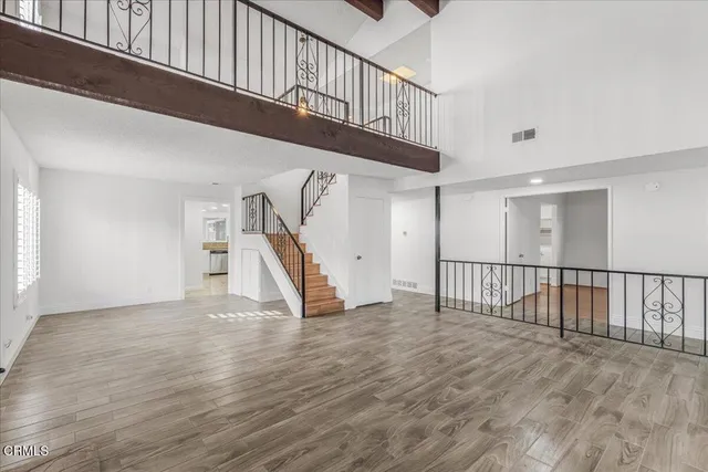 a view of entryway with wooden floor