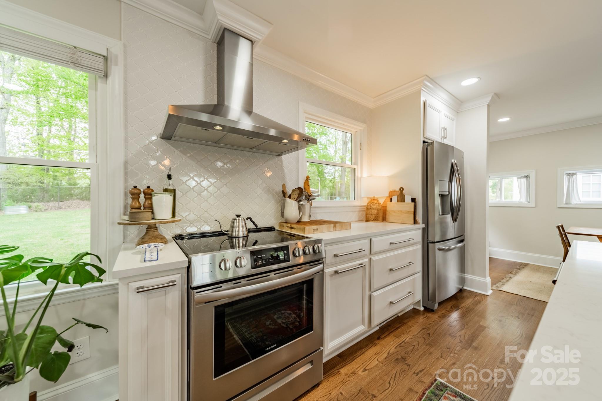 6339 Montpelier Road Charlotte, NC 28210 - Photo 12 of 35 a kitchen with stainless steel appliances granite countertop a stove a refrigerator and a sink
