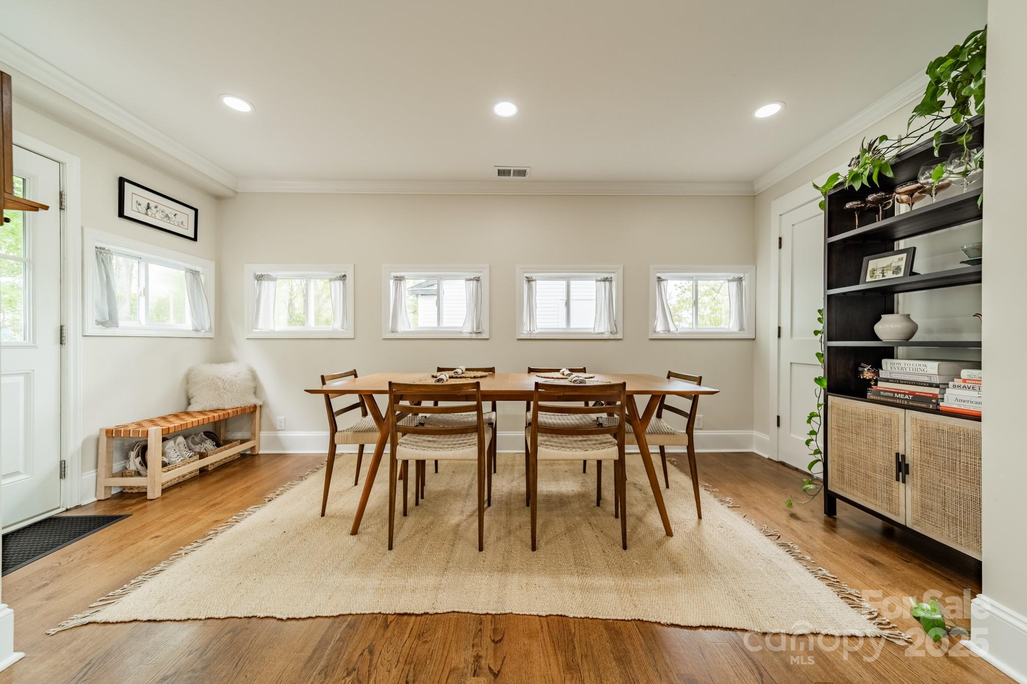 6339 Montpelier Road Charlotte, NC 28210 - Photo 14 of 35 a dining hall with stainless steel appliances granite countertop a stove a sink a dining table and chairs