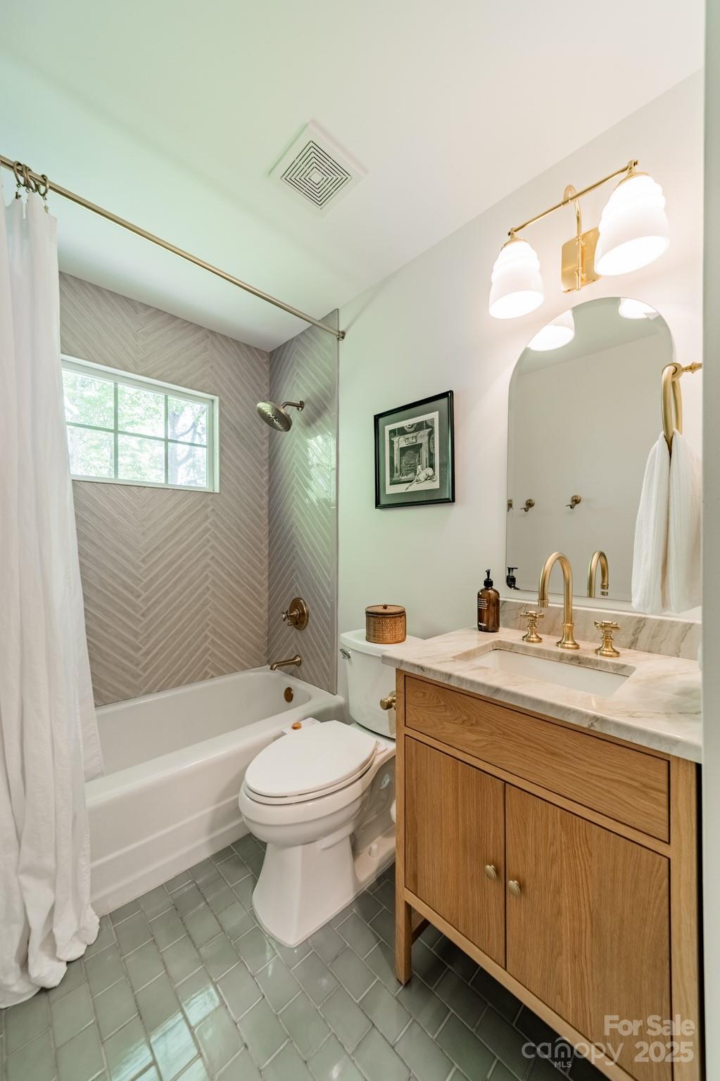 6339 Montpelier Road Charlotte, NC 28210 - Photo 17 of 35 a bathroom with a toilet sink and mirror