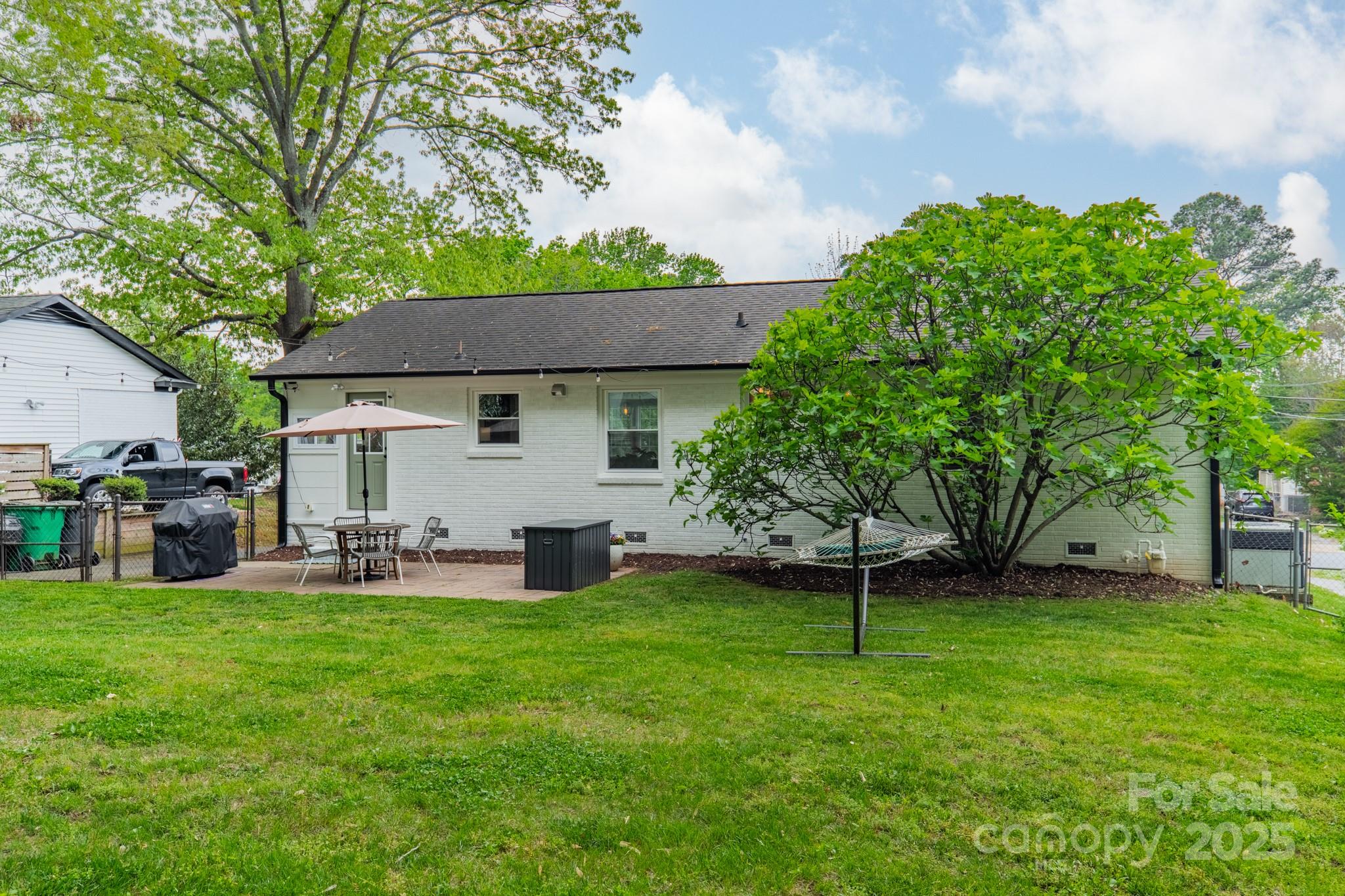 6339 Montpelier Road Charlotte, NC 28210 - Photo 27 of 35 a view of a house with a yard and sitting area