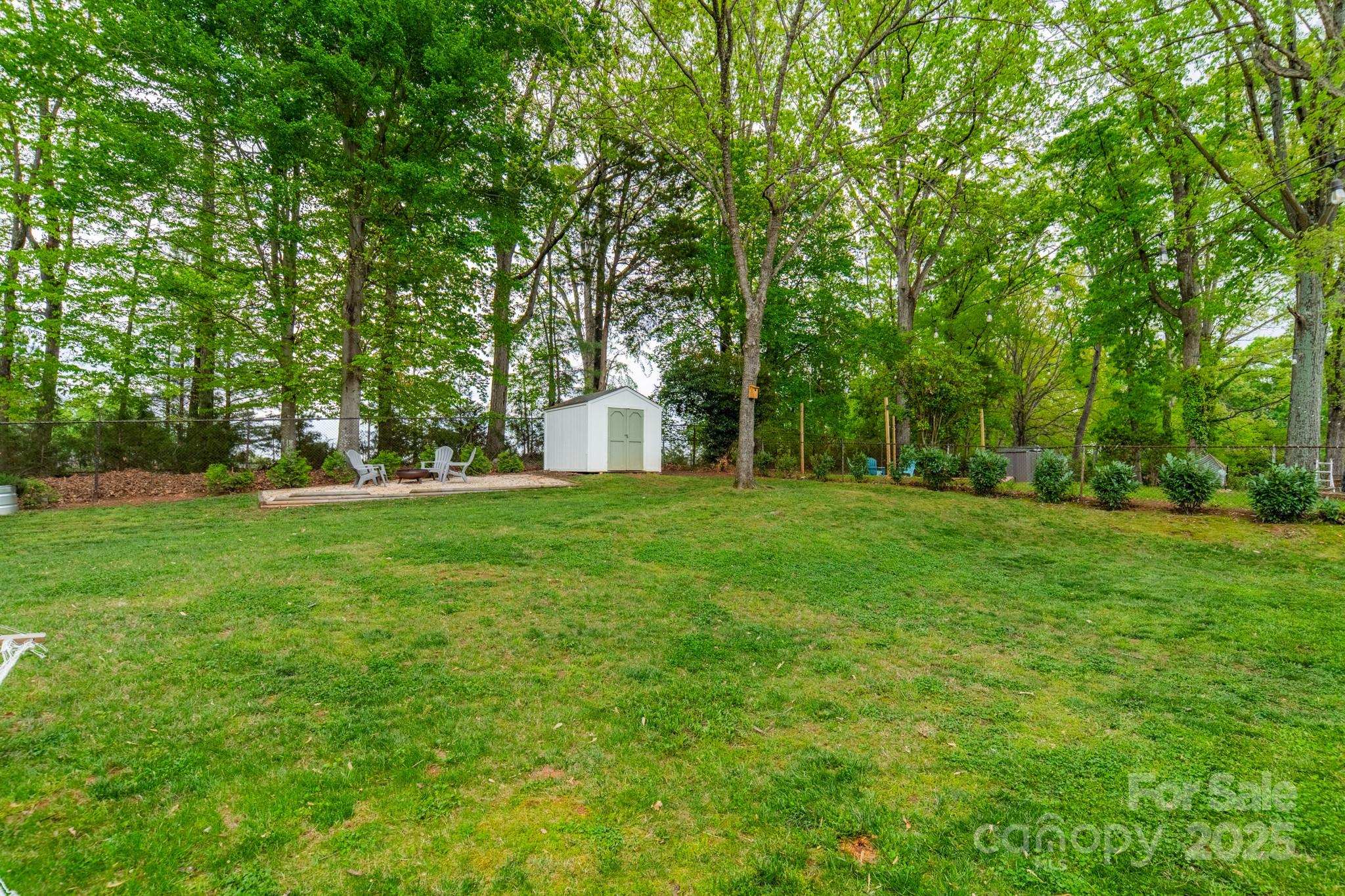 6339 Montpelier Road Charlotte, NC 28210 - Photo 29 of 35 a view of a garden with trees