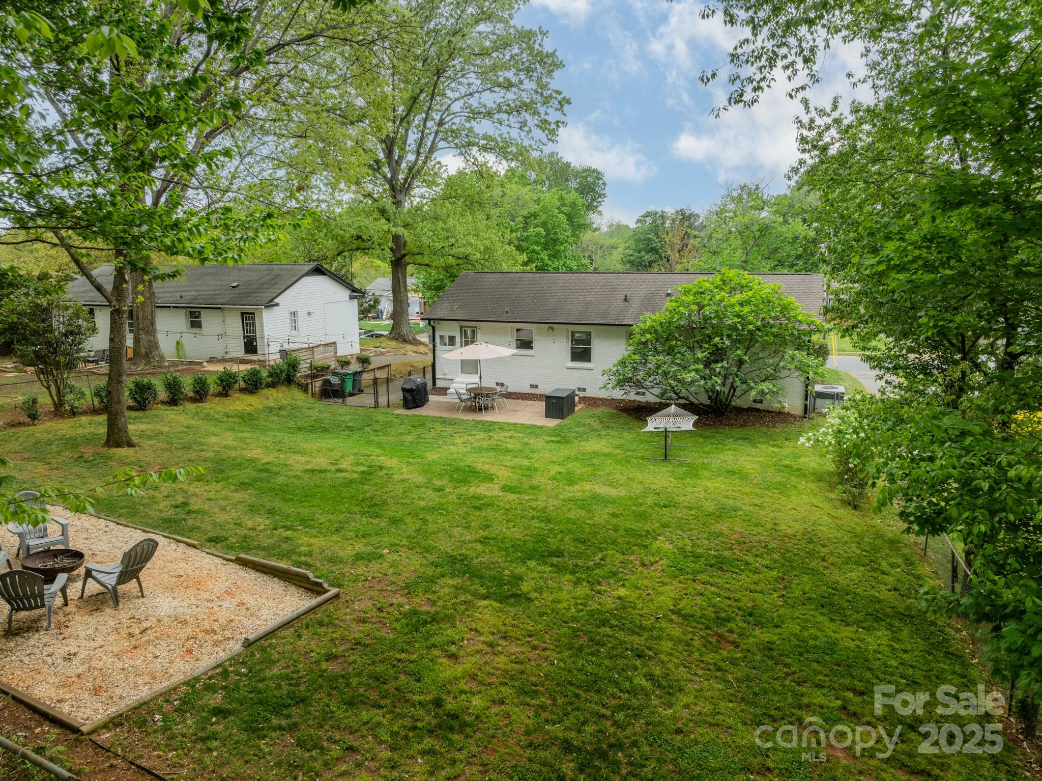 6339 Montpelier Road Charlotte, NC 28210 - Photo 33 of 35 a view of a house with a yard and sitting area