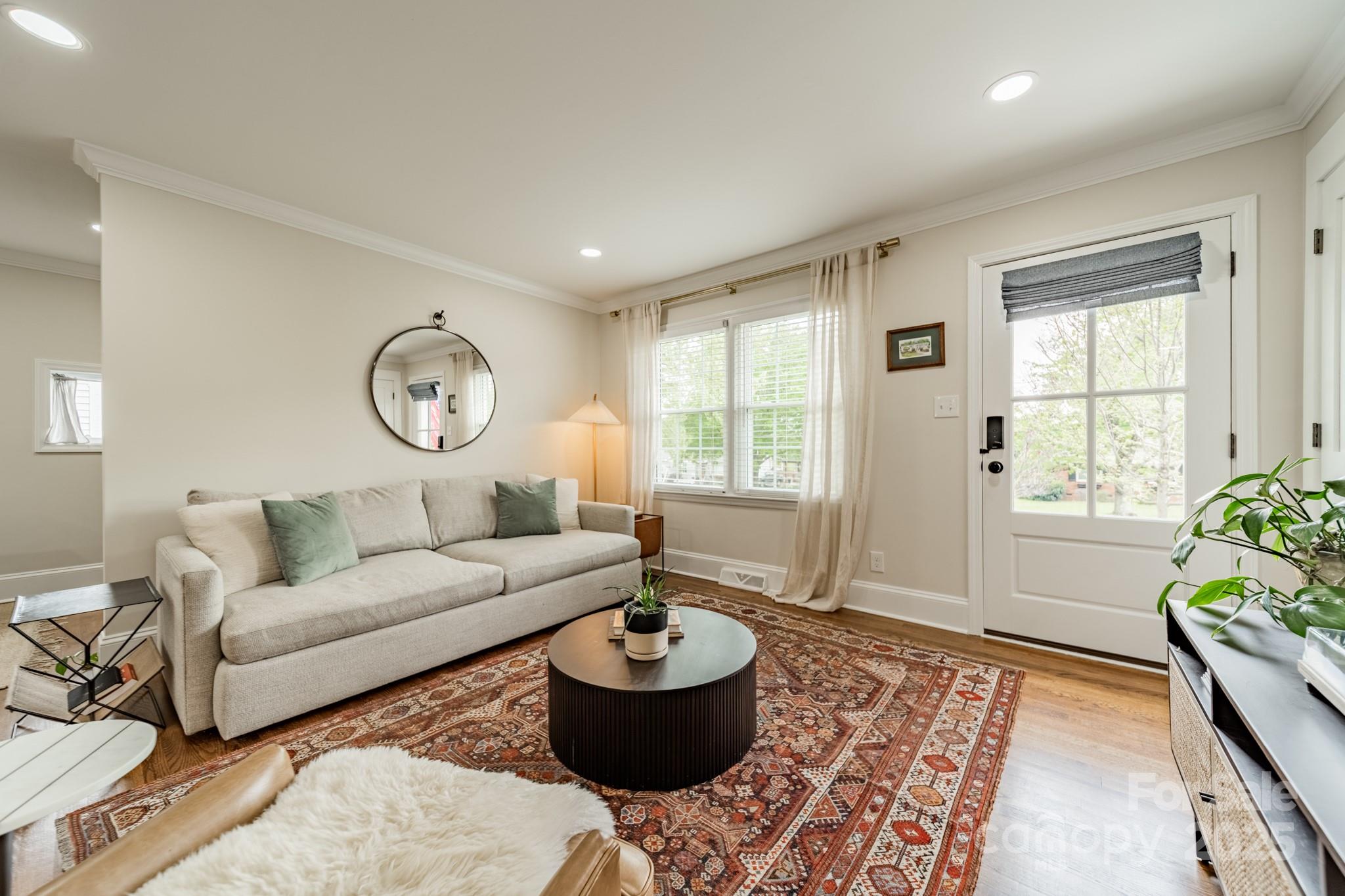 6339 Montpelier Road Charlotte, NC 28210 - Photo 6 of 35 a living room with furniture and a large window