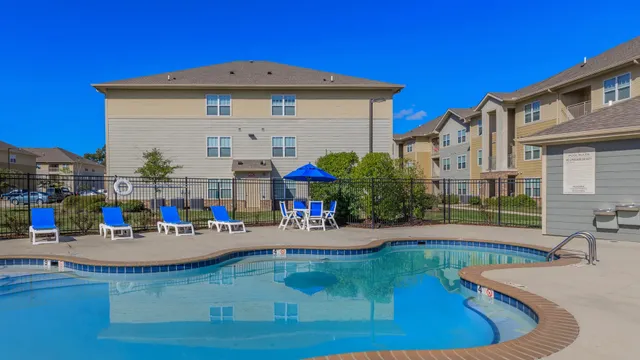 a view of swimming pool with outdoor seating