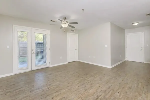 a view of an empty room with a window