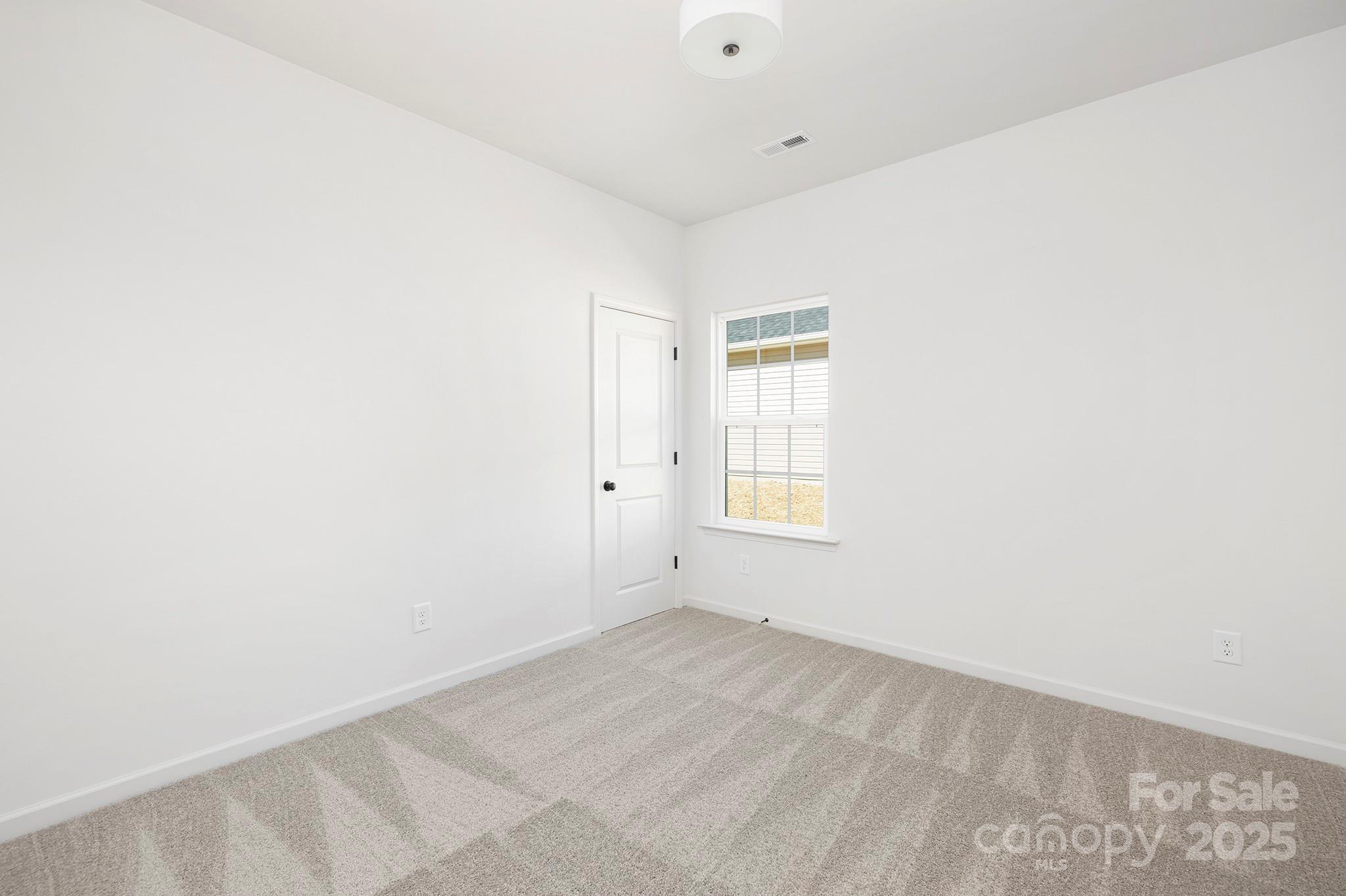 159 Dry Dock Loop Mooresville, NC 28117 - Photo 12 of 18 an empty room with a window