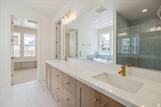 952 Mathilda Drive, Unit 156 Saratoga Springs, UT 84045 - Photo 15 of 25 Bathroom featuring a dual vanity with light wood cabinetry, white countertops, and integrated rectangular sinks with brass-finish faucets