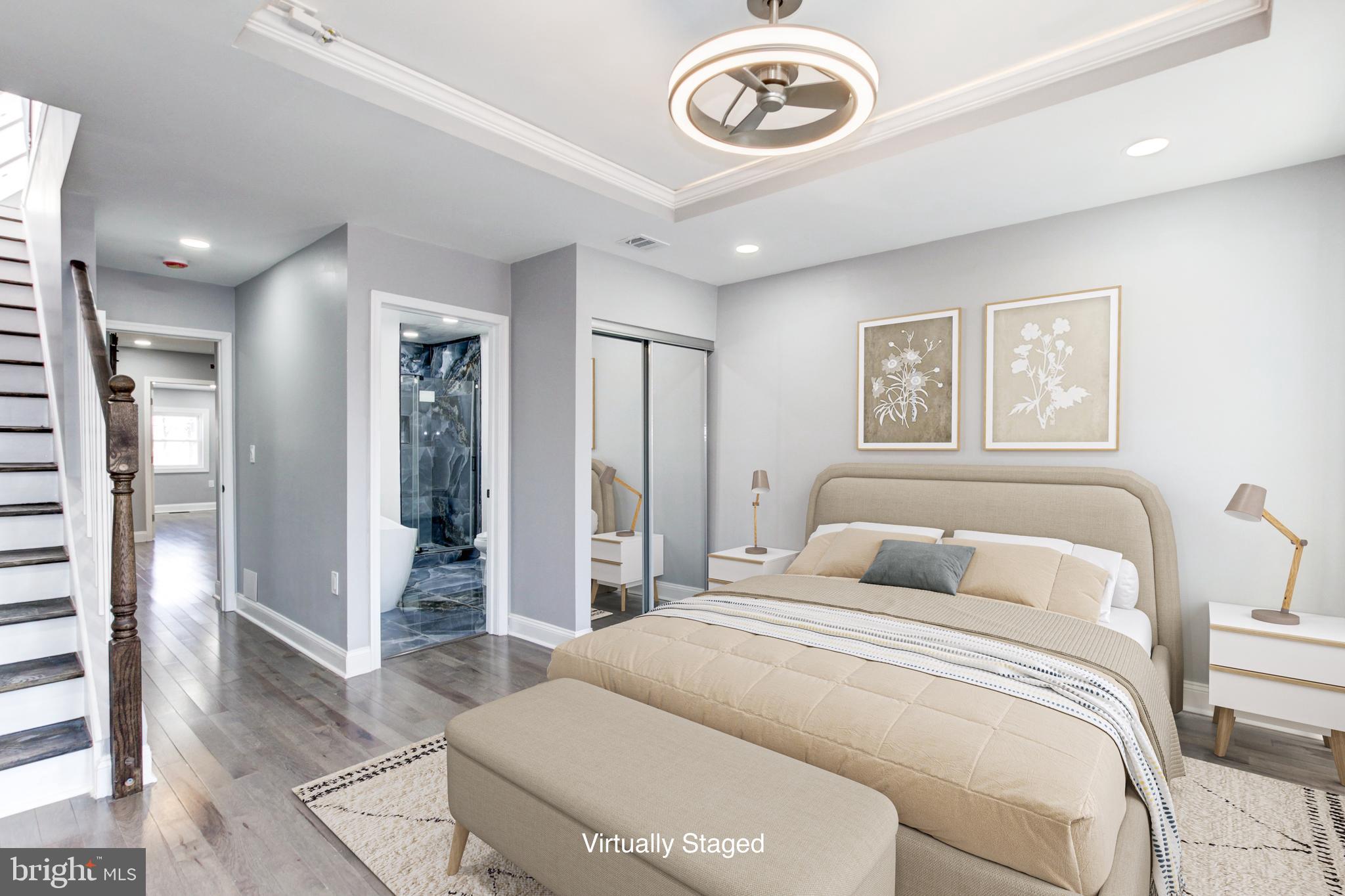 1613 Aisquith Street Baltimore, MD 21202 - Photo 26 of 46 a bedroom with a bed and a chandelier