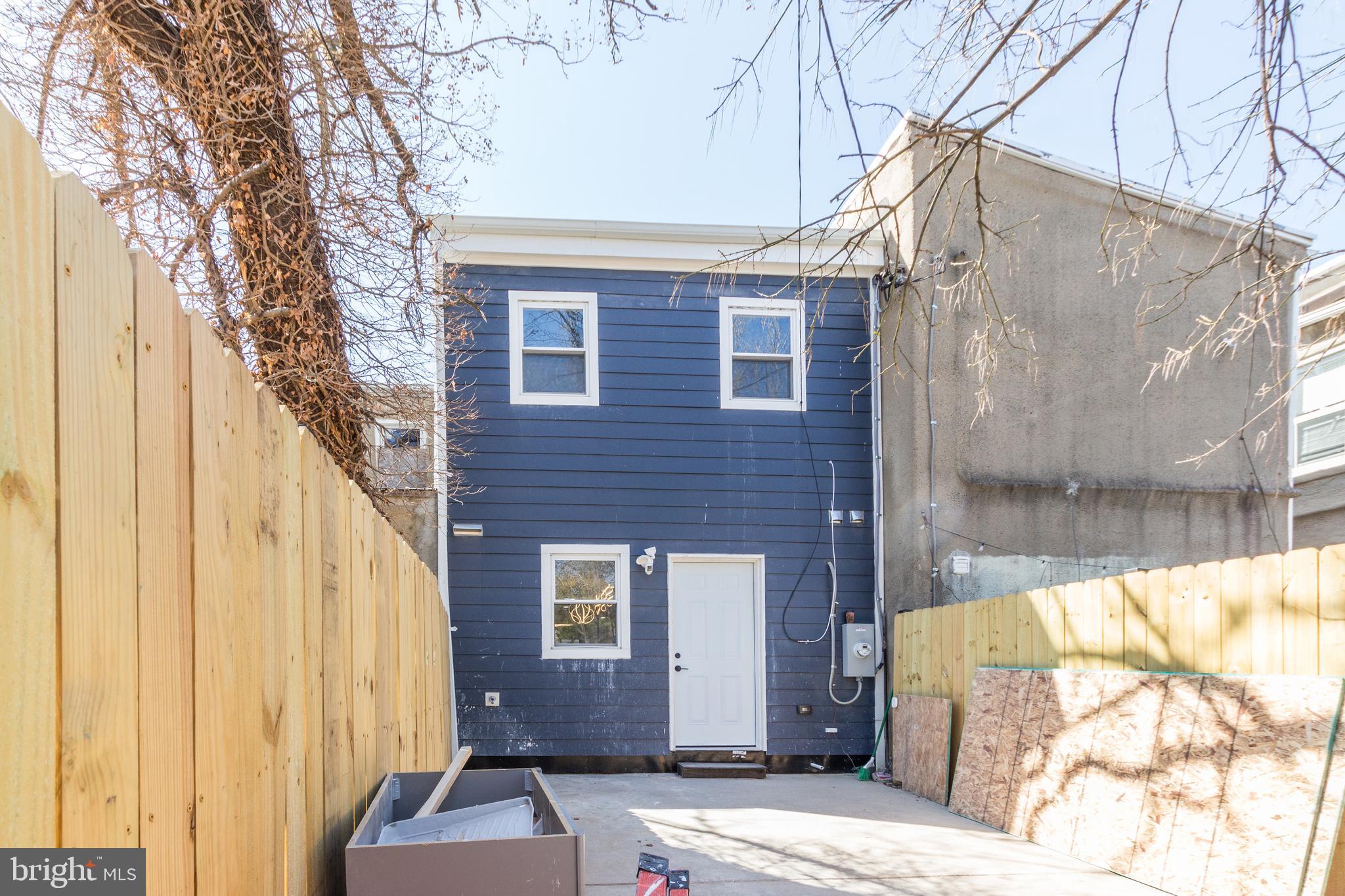 1613 Aisquith Street Baltimore, MD 21202 - Photo 43 of 46 a front view of a house with a yard