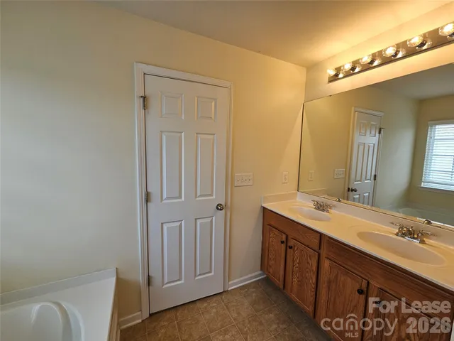 a bathroom with a shower and a tub