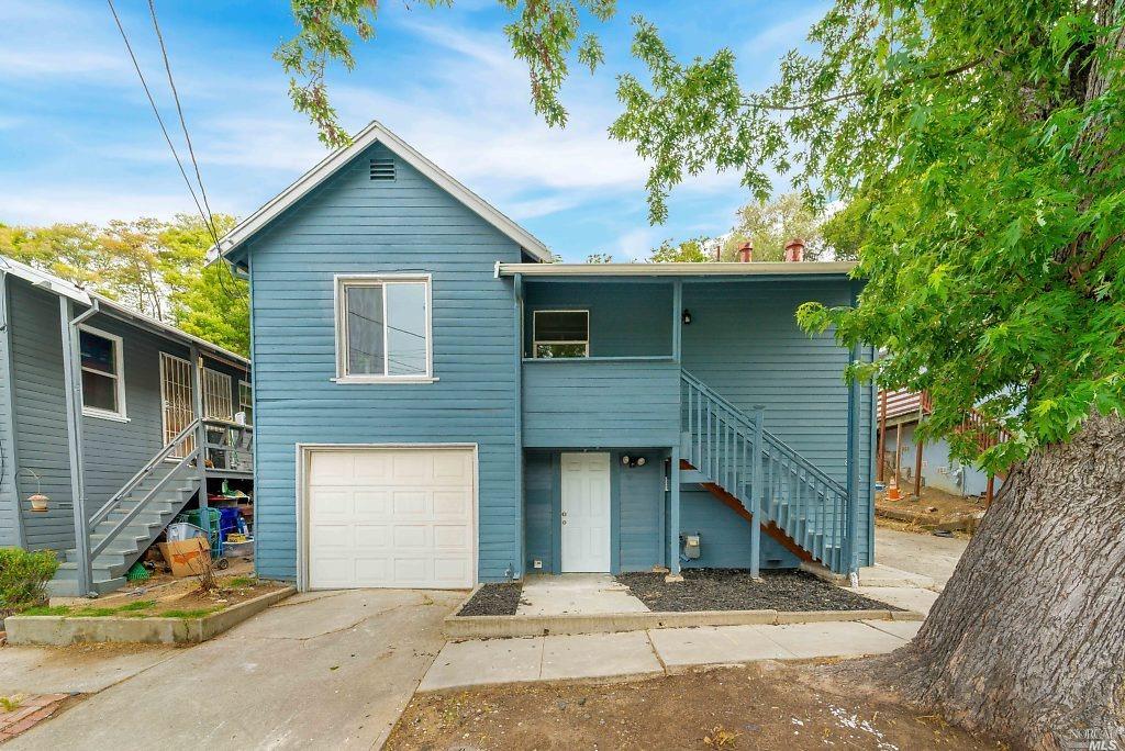 836 Mariposa Street Rodeo, CA 94572 - Photo 1 of 1 a front view of a house with a garage
