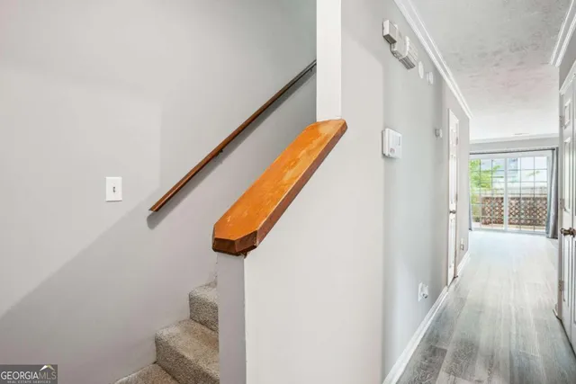 a view of a room with a ceiling fan and a bathroom