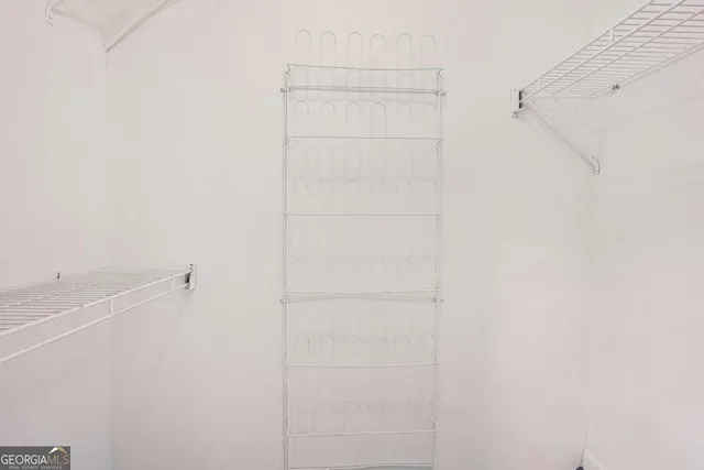 a bathroom with a sink toilet and a mirror