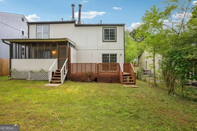 a view of a house with a back yard