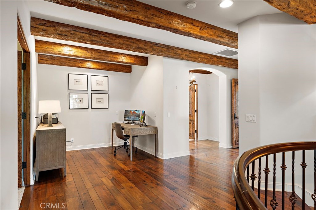 5 Via Monarca Street Dana Point, CA 92629 - Photo 25 of 64 a view of a hallway with wooden floor and furniture