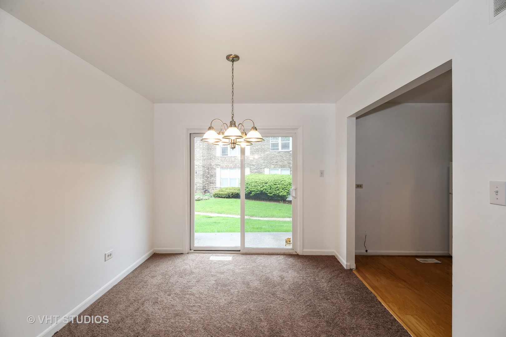 2250 Heather Road Homewood, IL 60430 - Photo 4 of 10 a view of a room with window a kitchen and a chandelier