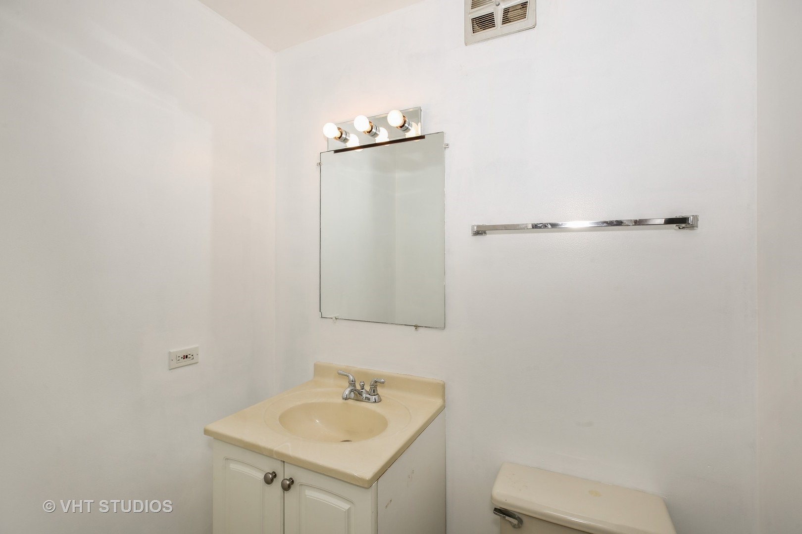 2250 Heather Road Homewood, IL 60430 - Photo 8 of 10 a bathroom with a sink toilet and mirror