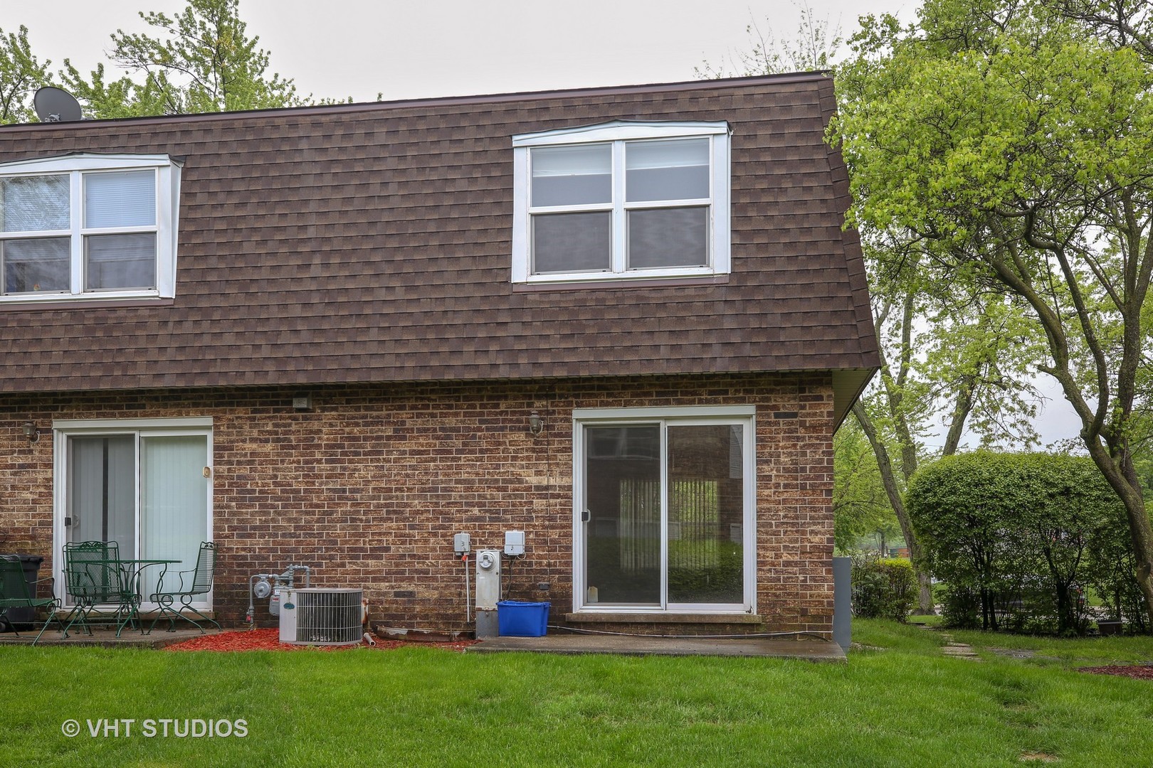2250 Heather Road Homewood, IL 60430 - Photo 10 of 10 a brick house that has a small yard and large trees