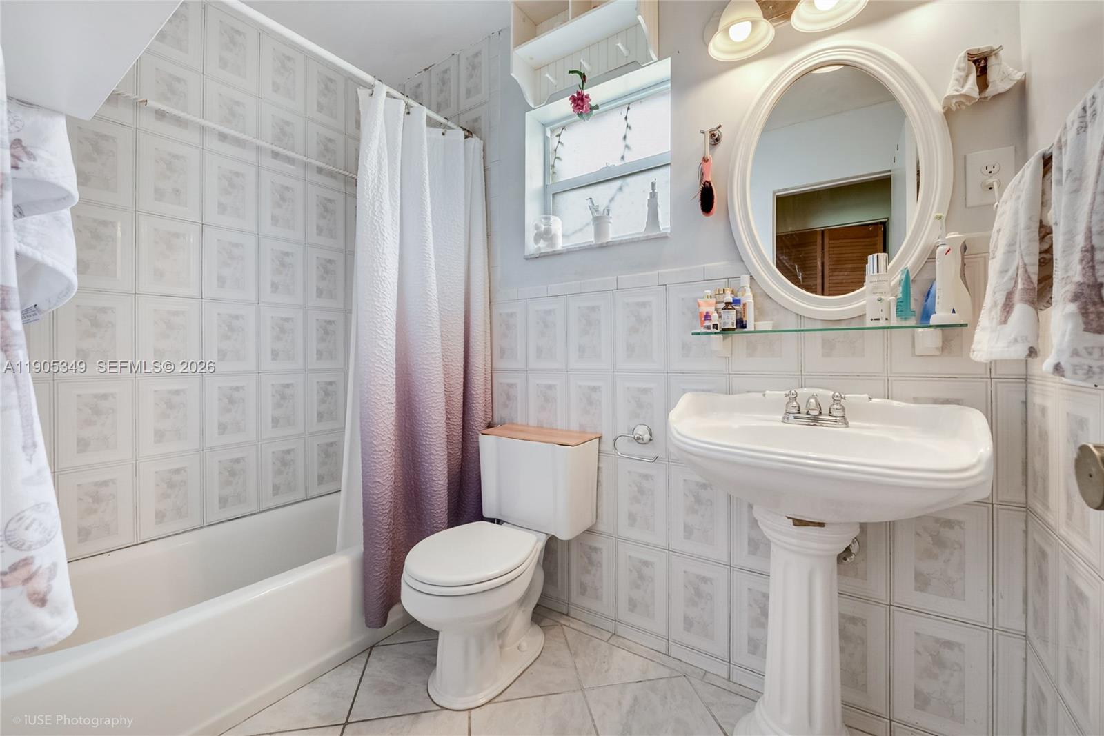9500 Southwest 79th Street Miami, FL 33173 - Photo 11 of 19 a bathroom with a sink toilet and shower