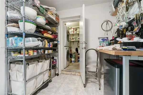 a view of a chair and table in backyard