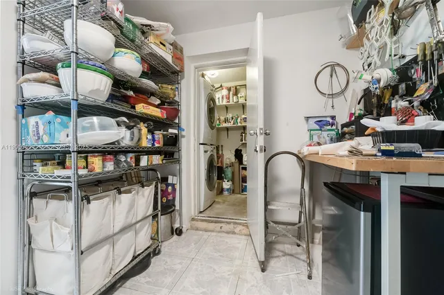 a kitchen with stainless steel appliances granite countertop a stove and a dining table
